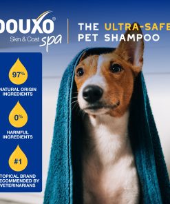 A dog in a towel, with text above reading DOUXO Skin and Coat SPA, the ultra-safe pet shampoo.